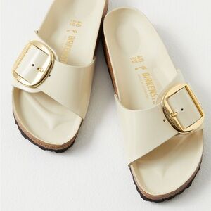 Birkenstock Cream Sandals with Gold Accent